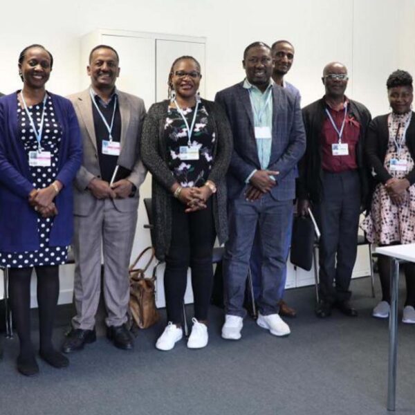 SKI Communication Officer and AFSA Team with the Africa Group of Negotiators Chairperson, Dr. Antwi-Boasiako Amoah in Maroon) at the SB64