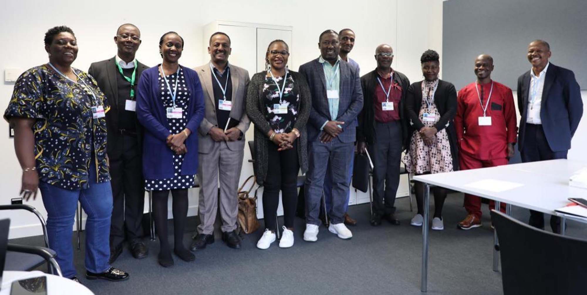 SKI Communication Officer and AFSA Team with the Africa Group of Negotiators Chairperson, Dr. Antwi-Boasiako Amoah in Maroon) at the SB64